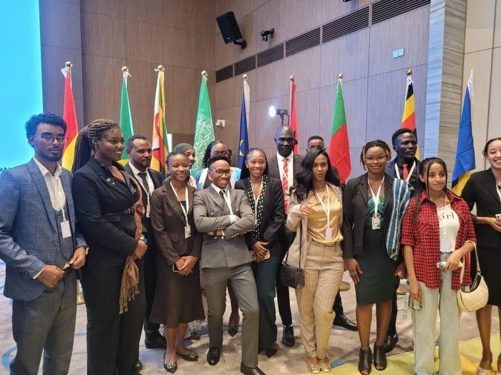 Young African delegates standing together after a leadership event